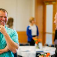 Two guests talking at the event.